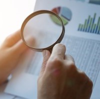 bigstock-Businessman-Looking-Through-A-308211097